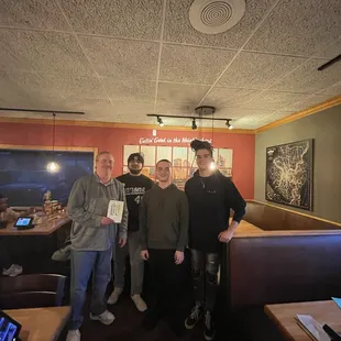 a group of men posing for a picture