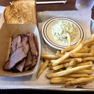 Beef brisket small plate with creamy cole slaw, French fries, and Texas toast.