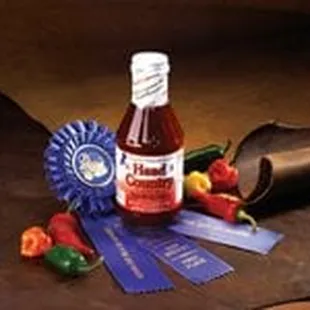 a bottle of hot sauce and ribbons