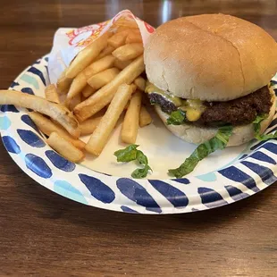 The Classic Single Cheeseburger with everything on it and fries. Picture taken at home.