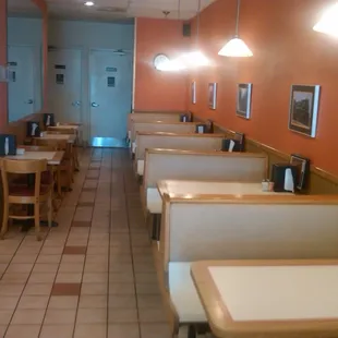 There is a single row of booths along the wall.