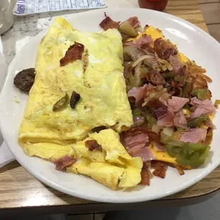 Meat lovers omelette and ultimate hash browns