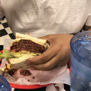 Pastrami on rye with lettuce tomatoes and provolone