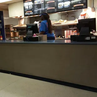 a woman behind the counter