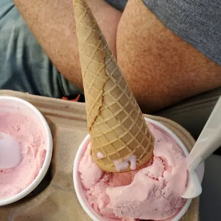 Kids cone of strawberry ice cream (huge amount of ice cream for kid, some leftover for mom!)
