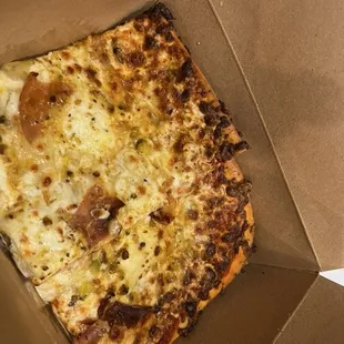 2 slices "specialty pizza" on focaccia