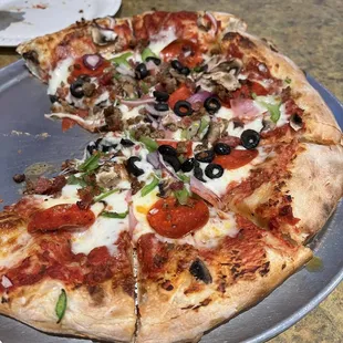 Combination Specialty Pizza size large, we had already pulled two pieces before I could snap a pic!