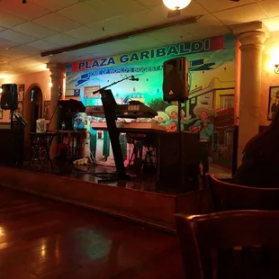 a man standing in front of a bar