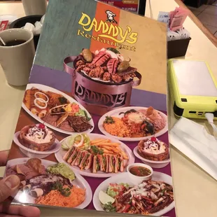 a person holding a menu