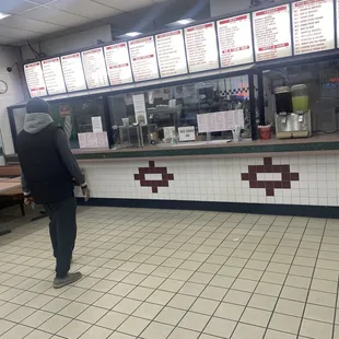 a man standing in front of the counter