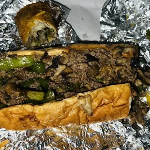 two sandwiches wrapped in tin foil