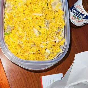 a bowl of rice with a spoon in it