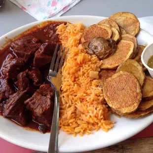 Braised beef with Spanish rice and seasoned fries. Delish!!!