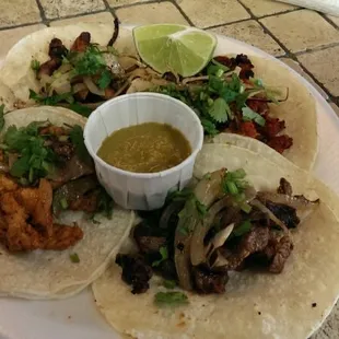 Chicken, beef, pork and chorizo tacos