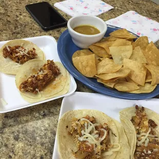 Chorizo breakfast tacos, bacon breakfast tacos and chips/salsa.