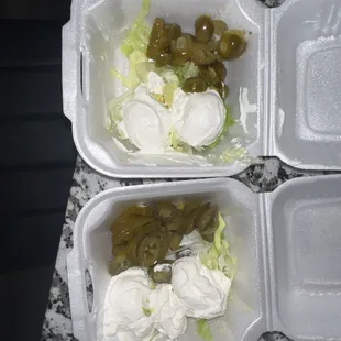 two takeout containers of food