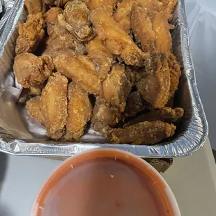 65 wing dings w/ hot sauce on side