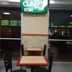 a restaurant with tables and chairs