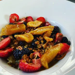 a bowl of fruit and granola