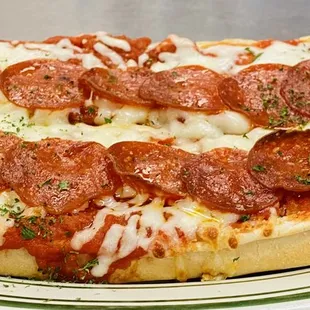 a pepperoni pizza on a plate