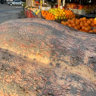 a large rock covered in fruit
