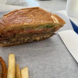 Double meat burger with bacon, cheese &amp; lettuce &amp; tomatoes. Juicy, flavorful!