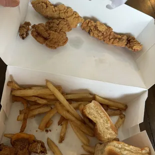 This is what $8 got me. Three very overcooked strips and a few fries.