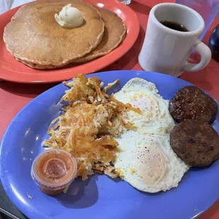 Two eggs, sausage, hashbrowns, and coffee