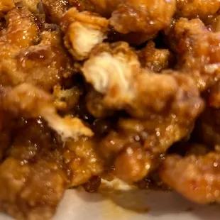 Described as lightly breaded checked breast is a soggy batter chicken that could be used for jerky it is so tough.   Orange Zest Chicken