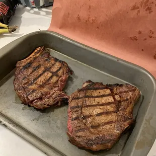 Our two ribeye steaks that we purchased from Dan&apos;s meat market.