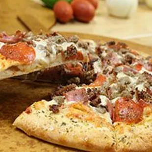 a half eaten pizza on a cutting board