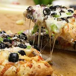 a slice being taken out of a pizza