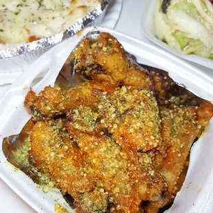 Hot garlic parmesan wings, salad, and chicken alfredo.