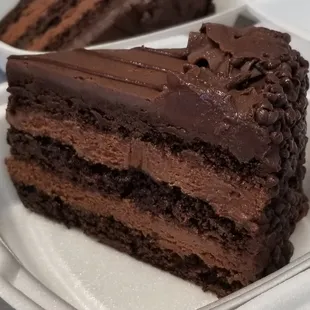 Triple layer Chocolate Mousse Elite is a chocolate lovers dream! Dense chocolate cake with thick layers of chocolate mousse i...