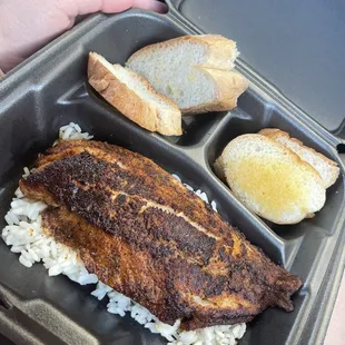 blackened redfish on a bed of rice &amp; butter bread