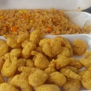 Already started eating this LOADED BOX of popcorn shrimp and spicy fried rice (substituted the fried). YUMMY