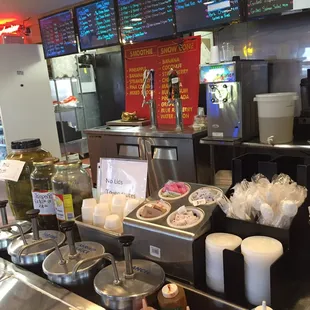 Condiments and menu behind the counter