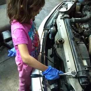 Christina loves to help dad. Don't worry; she's cheap labor.