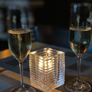 a glass of wine and a glass of wine on a table