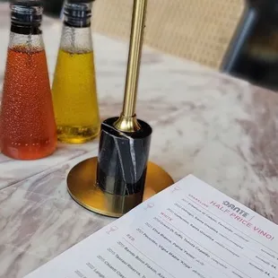 a table with a menu and a pen on it