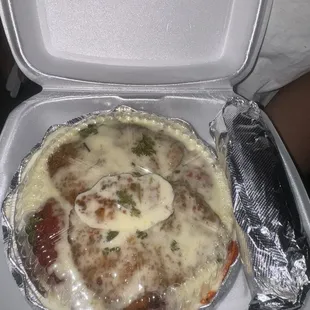 Chicken Parmesan over spaghetti, noodles and marinara