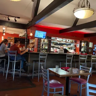 a group of people sitting at a bar
