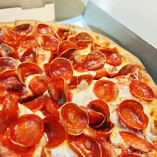 a pepperoni pizza in a box
