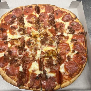 a pepperoni pizza in a box