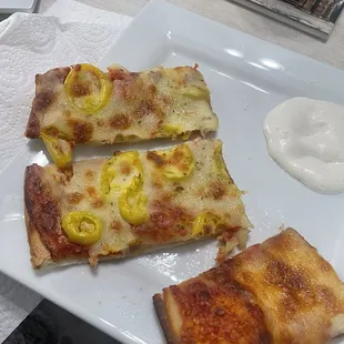 three slices of pizza on a plate