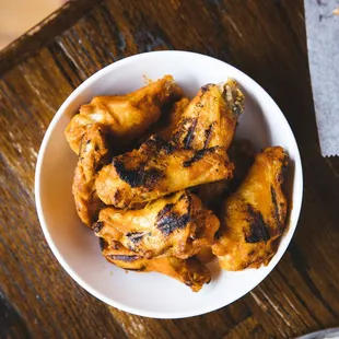 a bowl of chicken wings