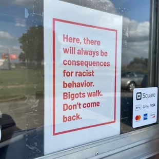 a sign in the window of a restaurant