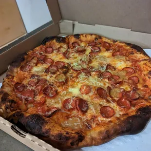 a pepperoni pizza in a box