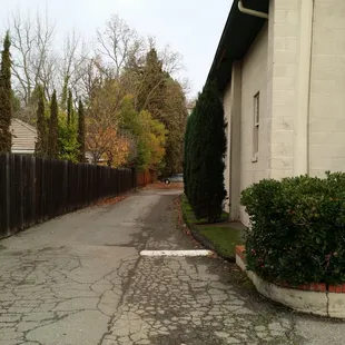 Driveway towards their private parking, located at the back! This is the exit, and the entrance is on the other end.