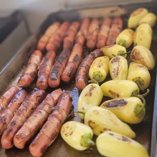 sausages and potatoes on a grill